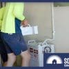 Australian electrician installing a modular home battery