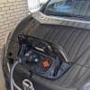 Nissan Leaf with charging cable.