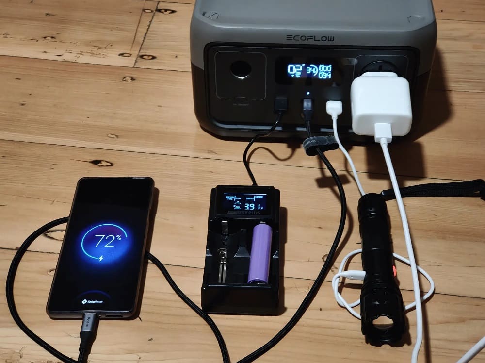 The Ecoflow portable power station powering several mobile devices at the same time.