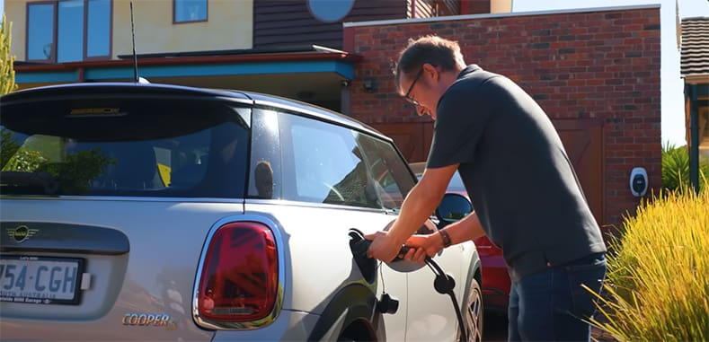 Finn plugging in his Mini at the end of his driveway