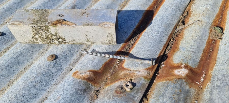 corroded roof with aluminium bracket