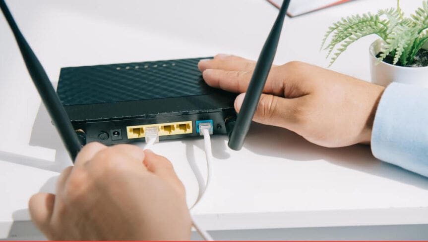 WiFi router with cables being plugged in