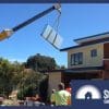 A crane hoists a solar thermal panel