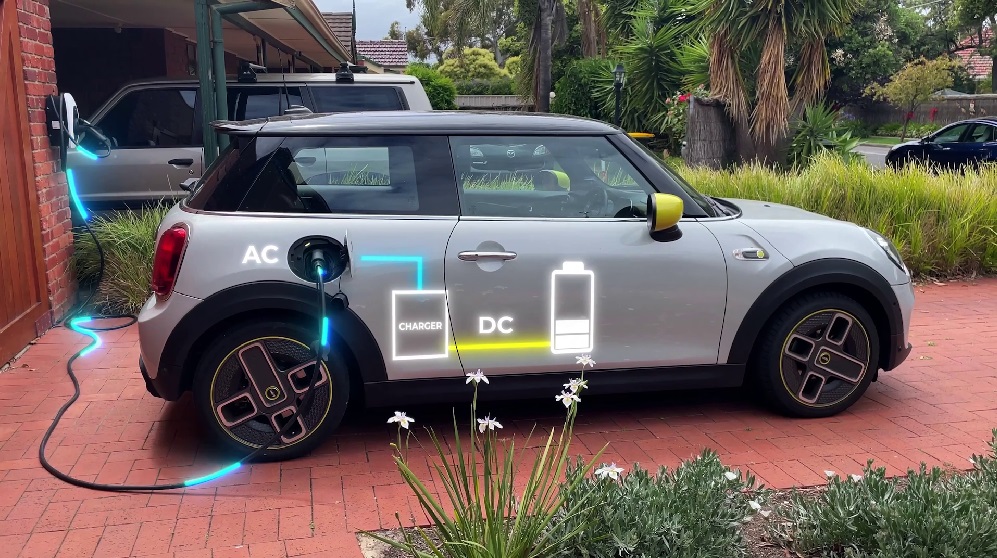 The onboard charger in an EV converts AC to DC to store it in its battery.